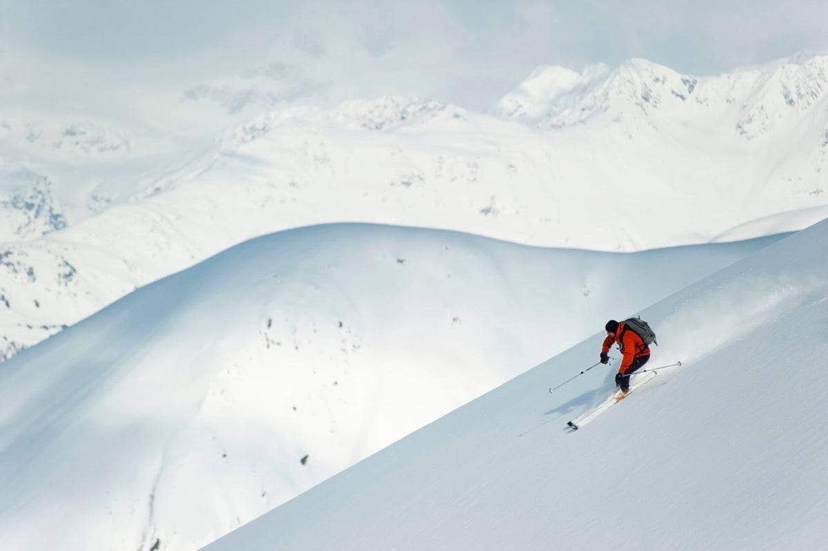 Man skiing the west face of Peak - Powderaddicts