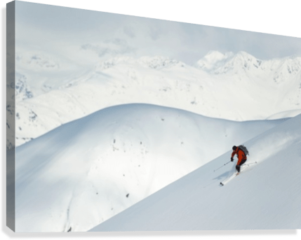 Man skiing the west face of Peak - Powderaddicts