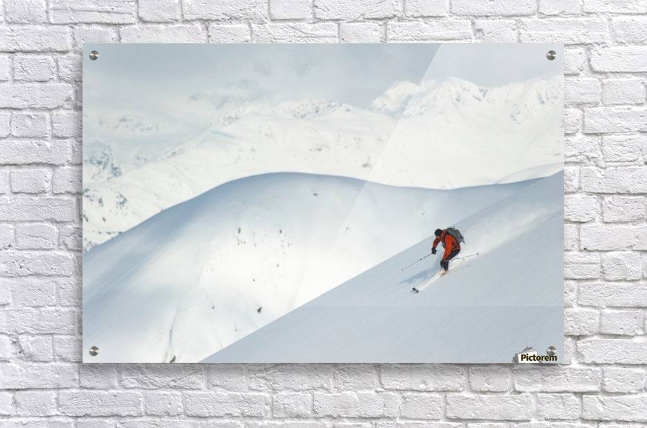 Man skiing the west face of Peak - Powderaddicts