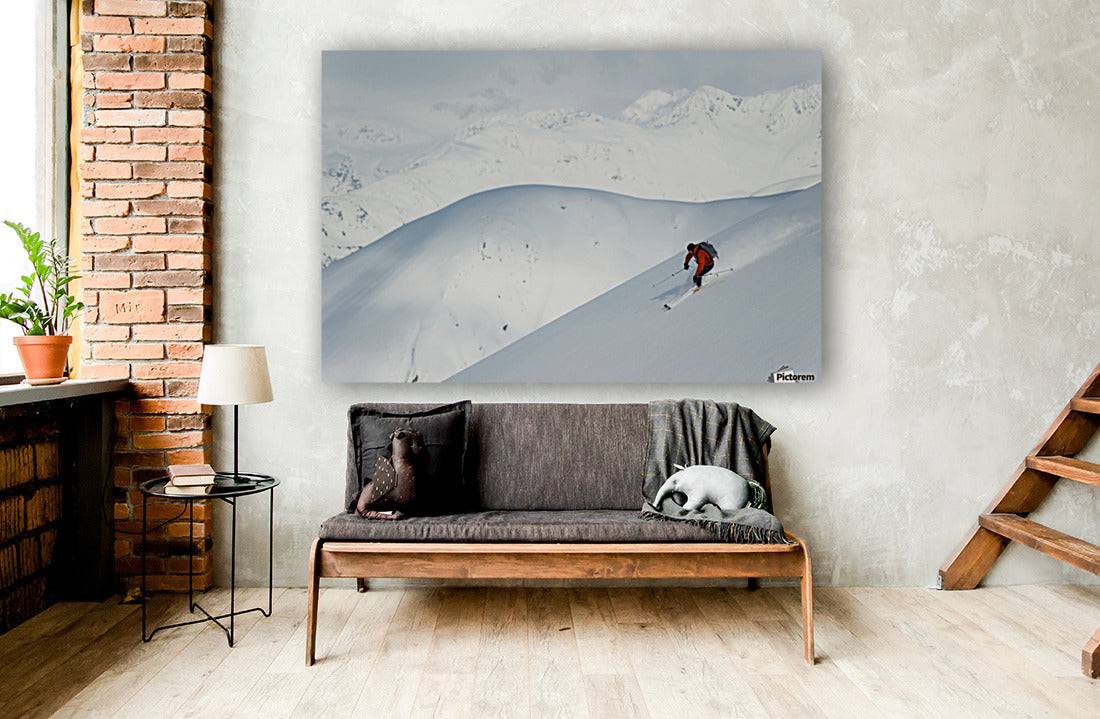 Man skiing the west face of Peak - Powderaddicts