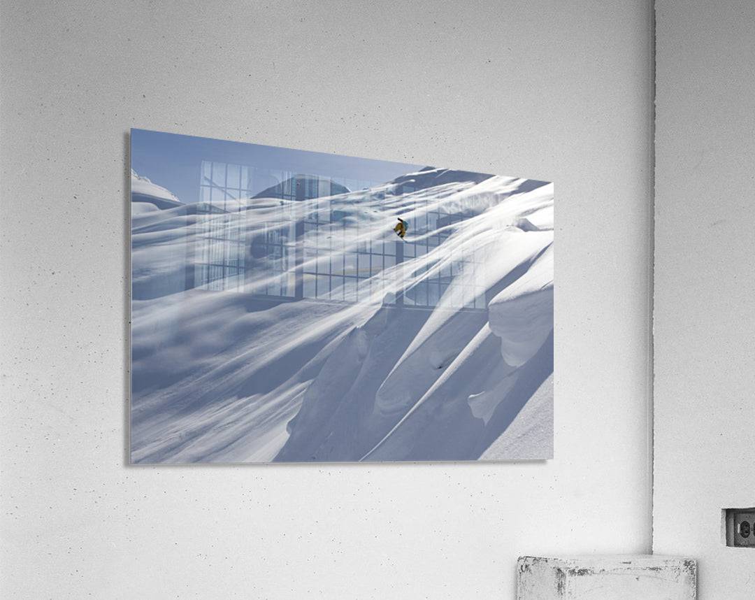 Professional snowboarder, Frederik Kalbermatten, heli boarding in the mountains above Haines - Powderaddicts