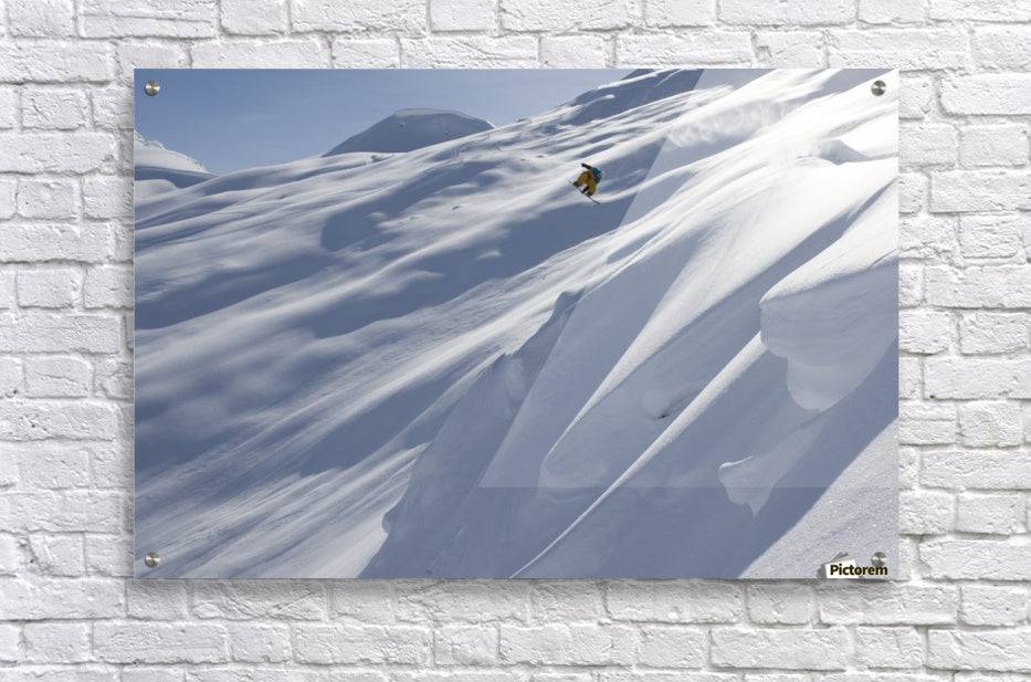 Professional snowboarder, Frederik Kalbermatten, heli boarding in the mountains above Haines - Powderaddicts