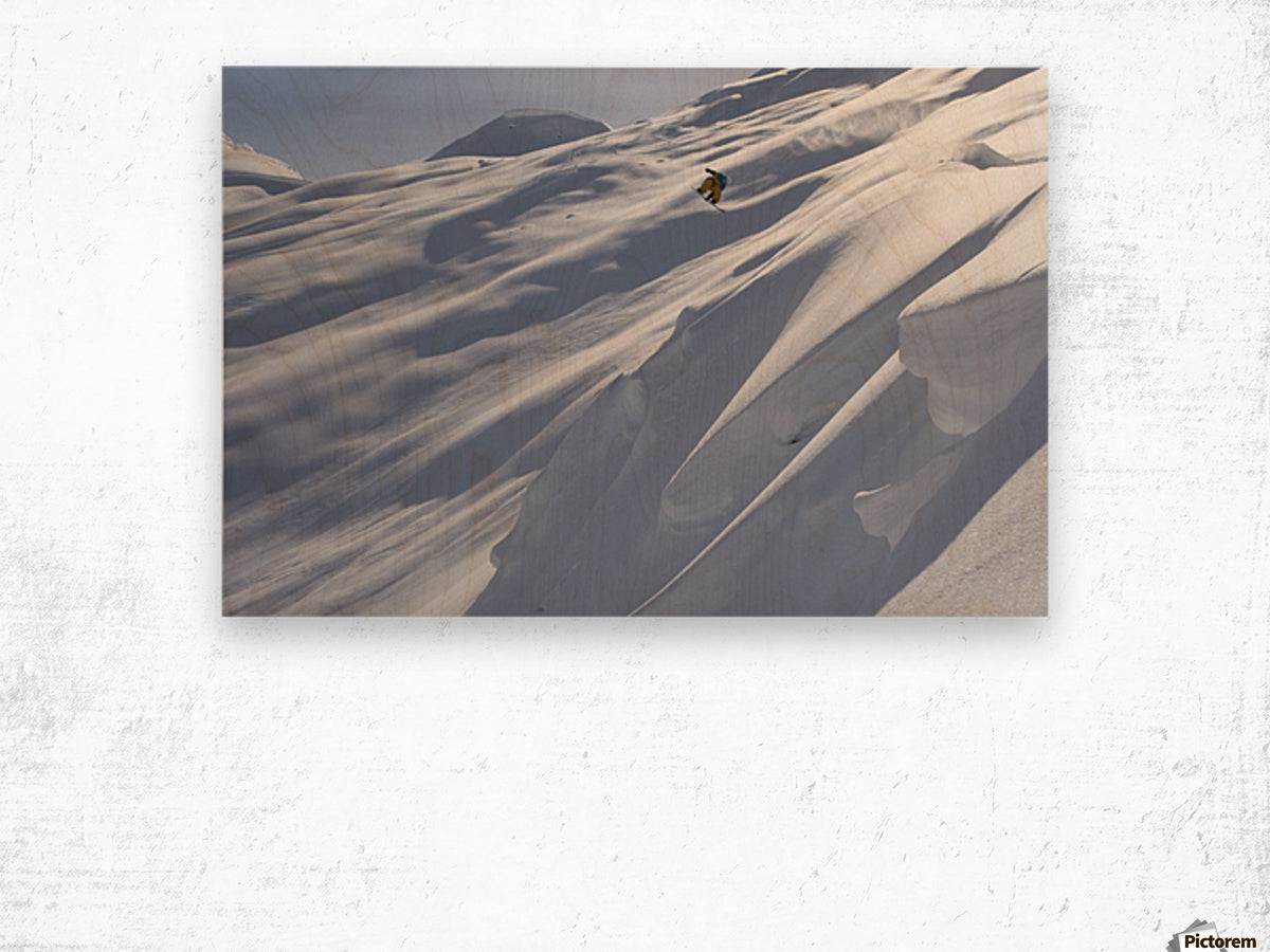 Professional snowboarder, Frederik Kalbermatten, heli boarding in the mountains above Haines - Powderaddicts