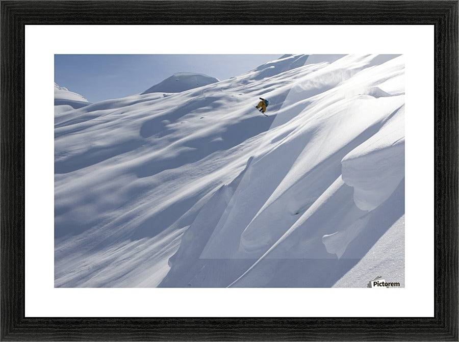 Professional snowboarder, Frederik Kalbermatten, heli boarding in the mountains above Haines - Powderaddicts