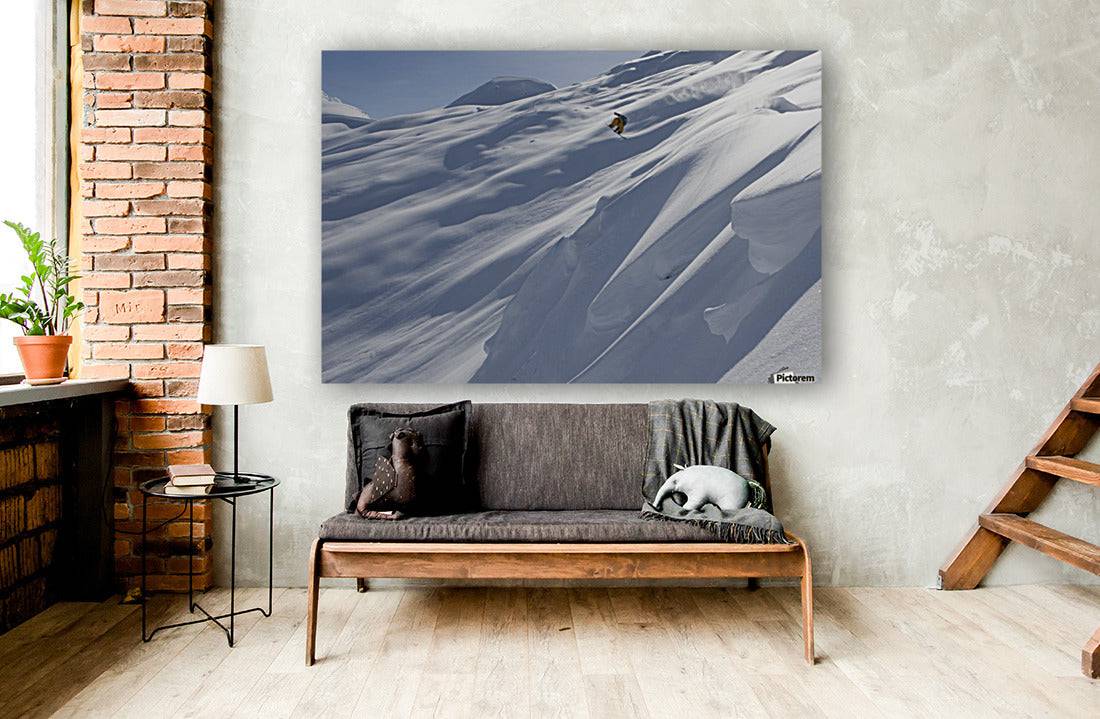 Professional snowboarder, Frederik Kalbermatten, heli boarding in the mountains above Haines - Powderaddicts