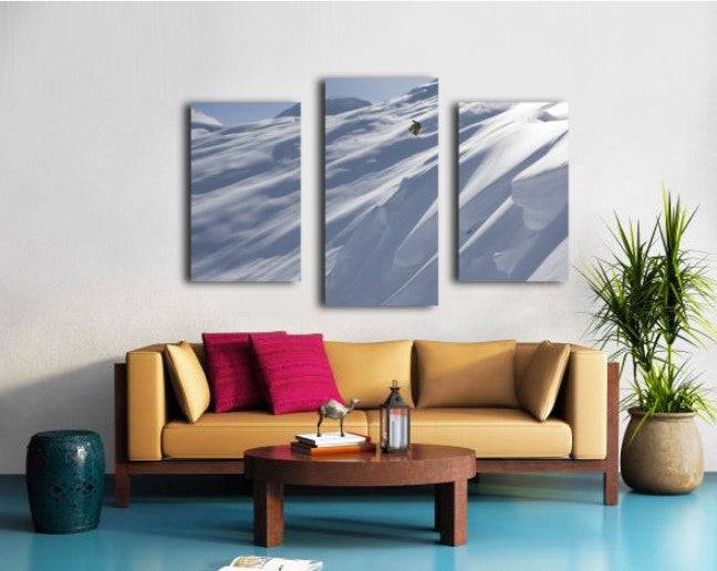 Professional snowboarder, Frederik Kalbermatten, heli boarding in the mountains above Haines - Powderaddicts