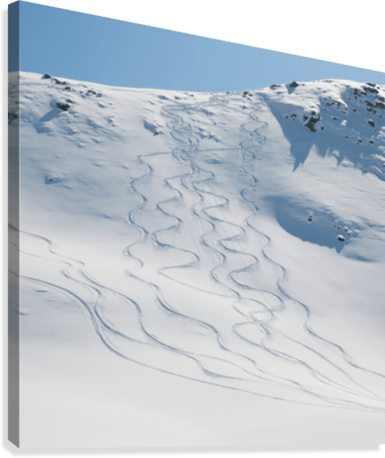 Ski tracks in the snow on a mountain - Powderaddicts
