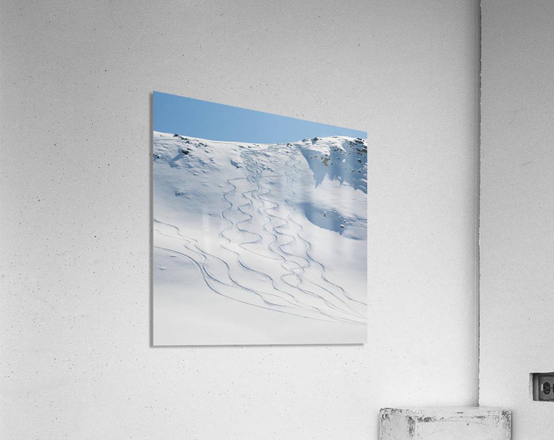 Ski tracks in the snow on a mountain - Powderaddicts