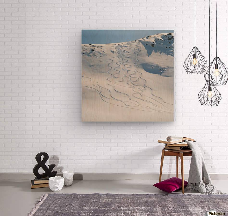 Ski tracks in the snow on a mountain - Powderaddicts