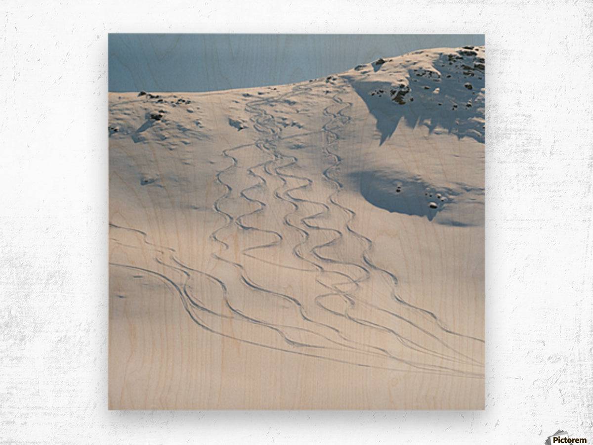 Ski tracks in the snow on a mountain - Powderaddicts