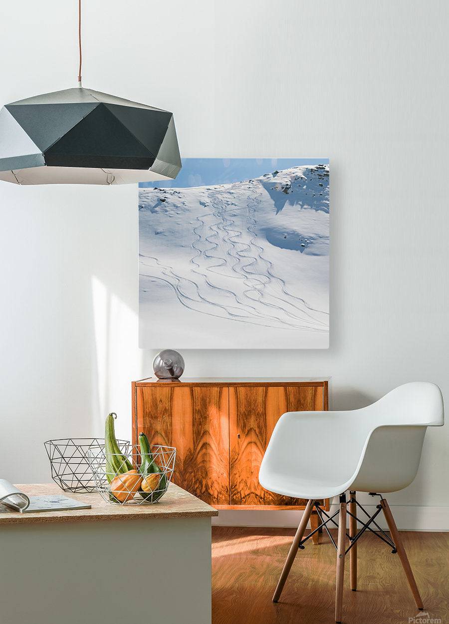 Ski tracks in the snow on a mountain - Powderaddicts