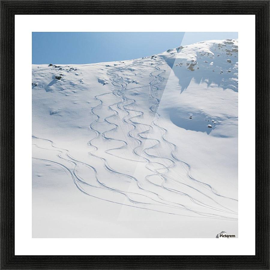 Ski tracks in the snow on a mountain - Powderaddicts