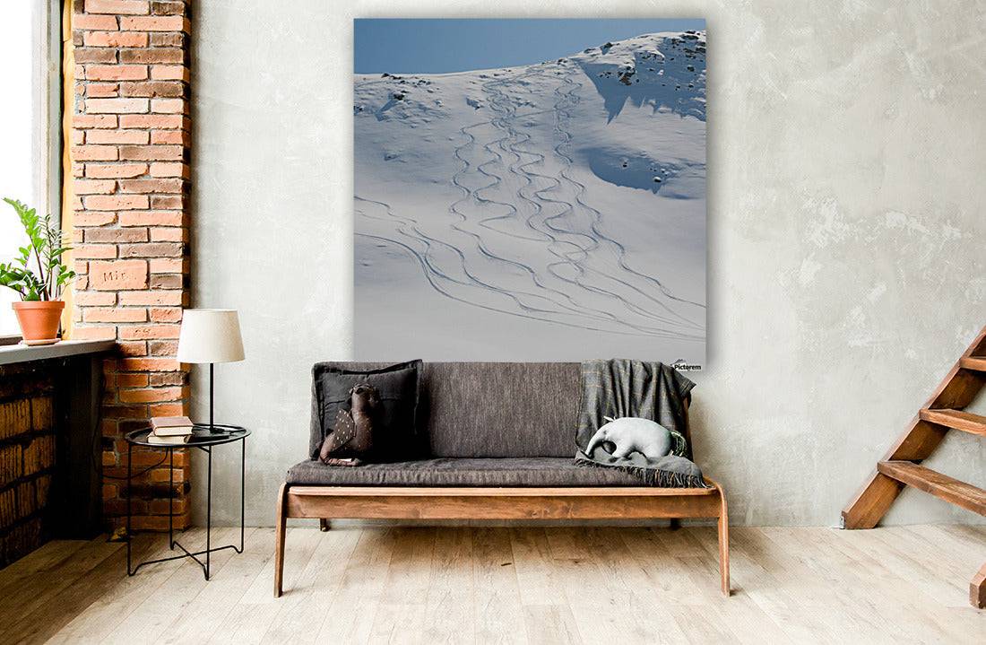 Ski tracks in the snow on a mountain - Powderaddicts