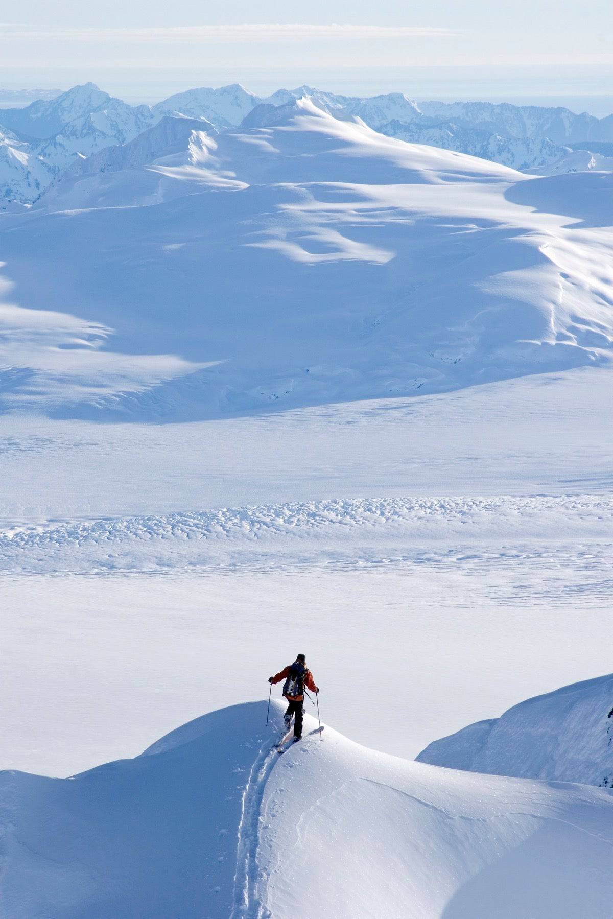 Skier Climbing Up Ridge - Powderaddicts