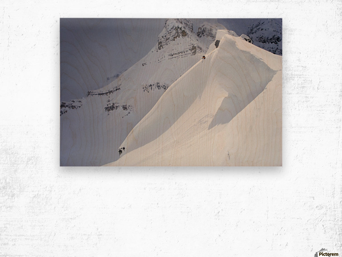 Skier On Crest Of Big Drop, Dwarfed By Mountain; Canada, British Columbia, Icefall Lodge - Powderaddicts