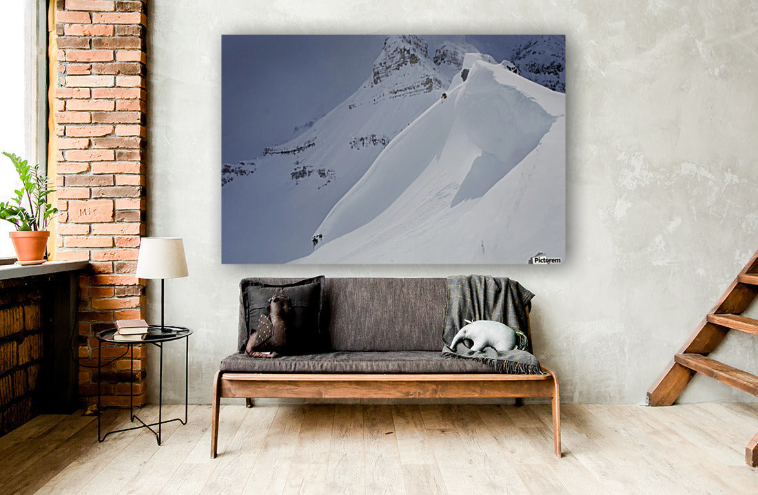 Skier On Crest Of Big Drop, Dwarfed By Mountain; Canada, British Columbia, Icefall Lodge - Powderaddicts