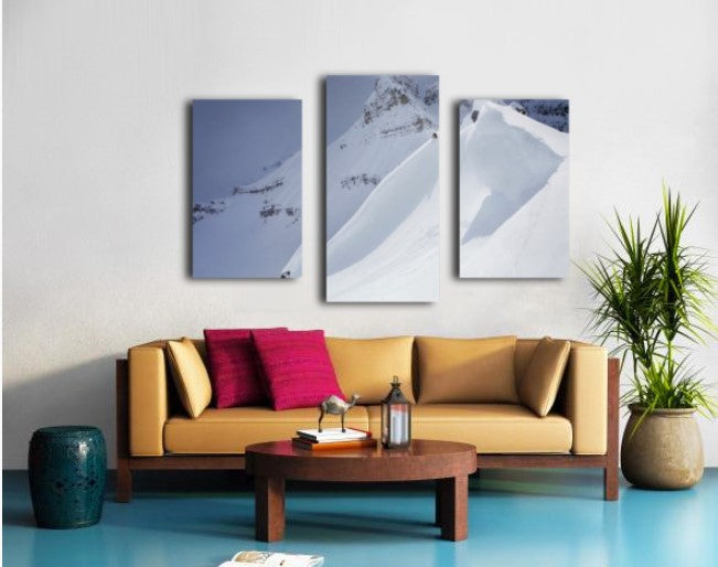 Skier On Crest Of Big Drop, Dwarfed By Mountain; Canada, British Columbia, Icefall Lodge - Powderaddicts