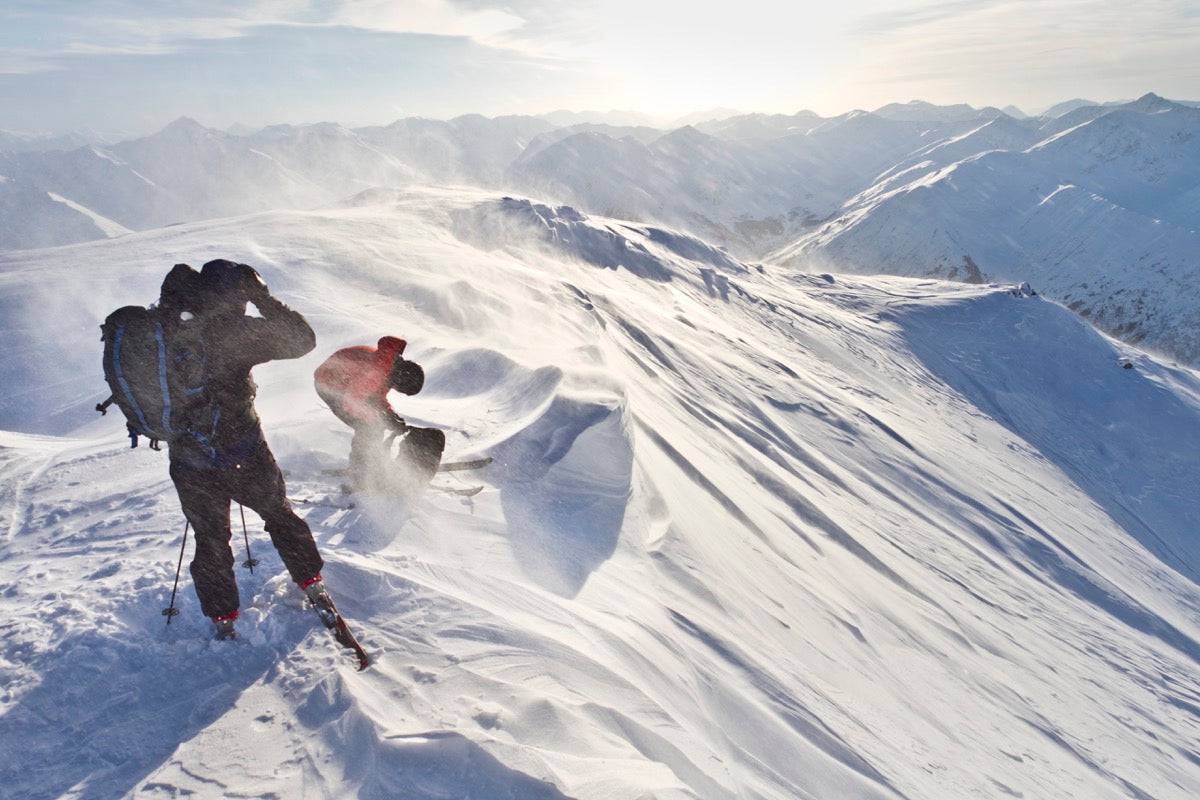 Skiers Prepare To Ski Down Peak 4940 In High Wind And Blowing Snow, Turnagain Pass, Kenai Mountains, Winter In Southcentral Alaska - Powderaddicts