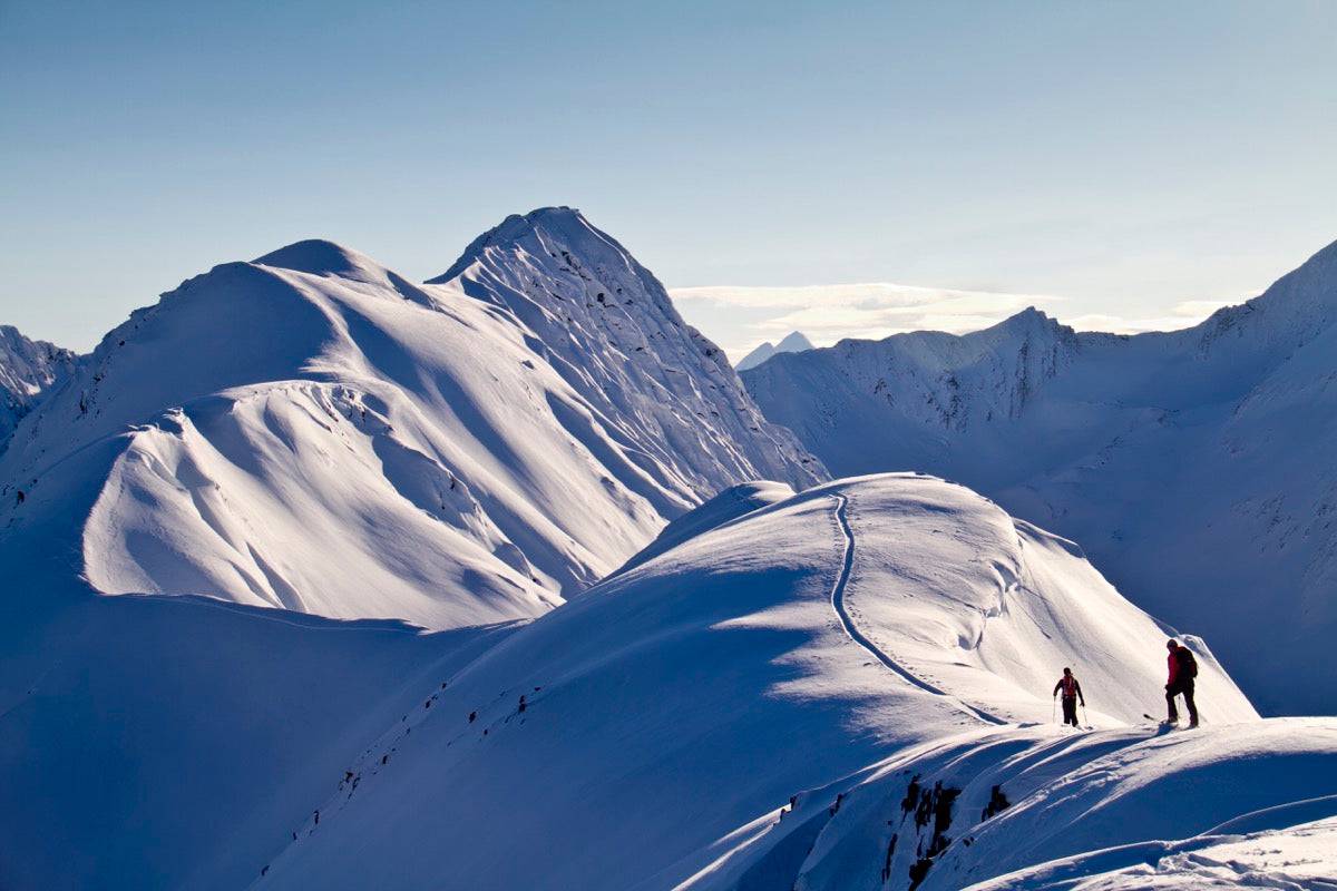 Skiers Skinning The Snow - Powderaddicts