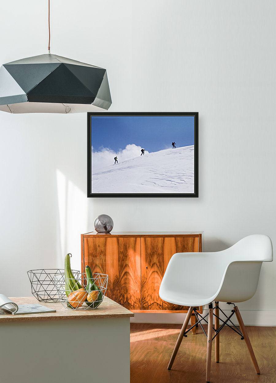 Three ski tourists walking to the summit - Powderaddicts