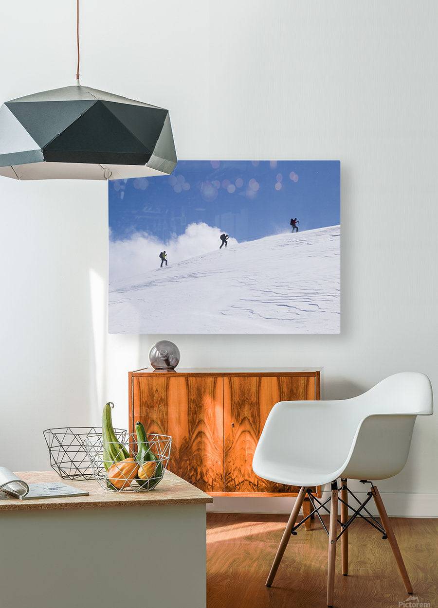 Three ski tourists walking to the summit - Powderaddicts