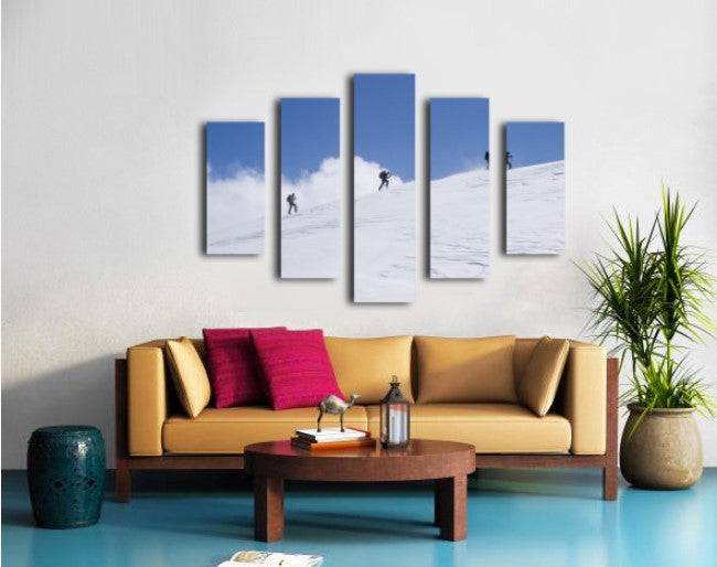 Three ski tourists walking to the summit - Powderaddicts