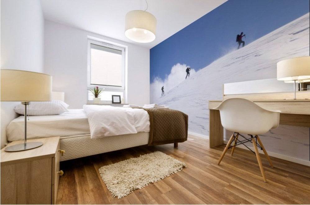 Three ski tourists walking to the summit - Powderaddicts