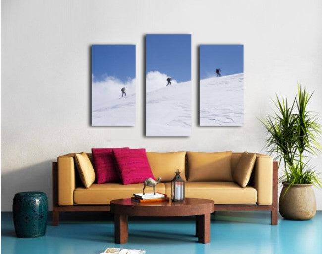 Three ski tourists walking to the summit - Powderaddicts