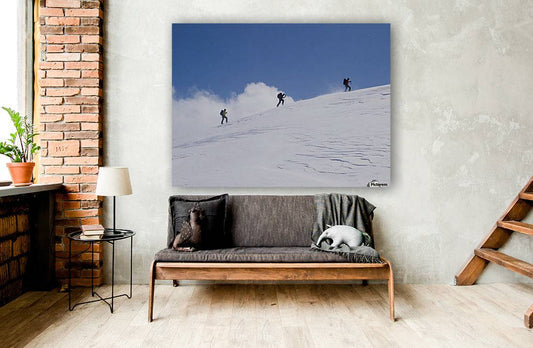 Three ski tourists walking to the summit - Powderaddicts