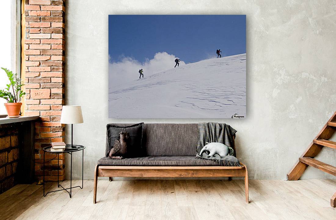 Three ski tourists walking to the summit - Powderaddicts