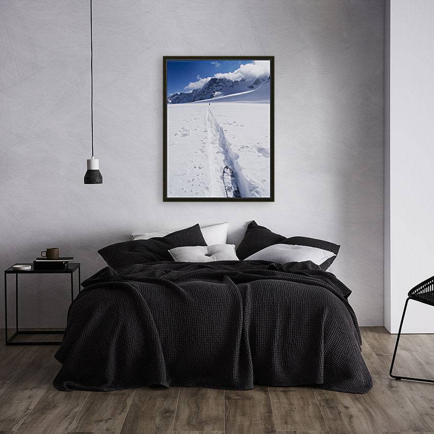 Two distant skiers ski touring across the Ottemma glacier, with skinning tracks - Powderaddicts