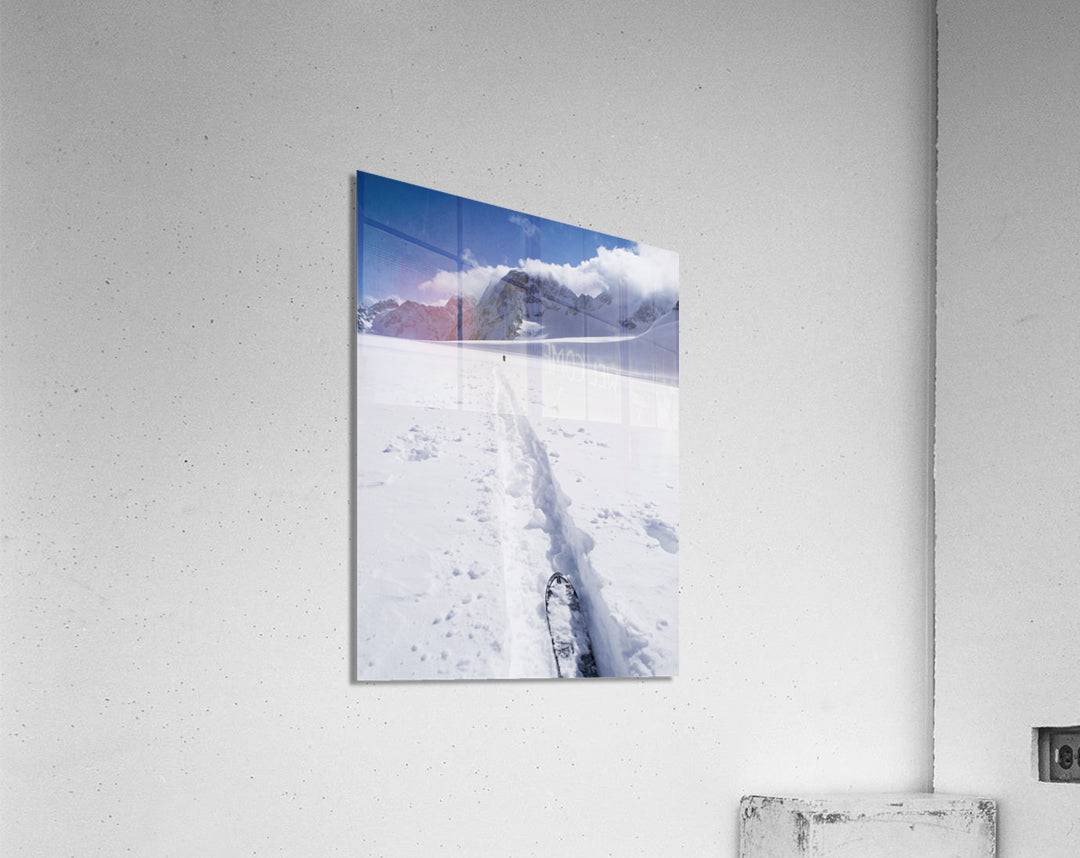 Two distant skiers ski touring across the Ottemma glacier, with skinning tracks - Powderaddicts