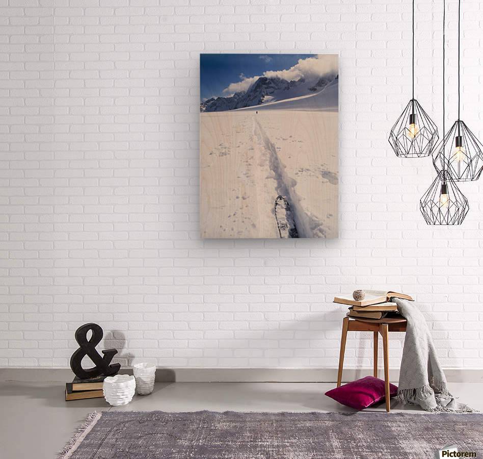 Two distant skiers ski touring across the Ottemma glacier, with skinning tracks - Powderaddicts