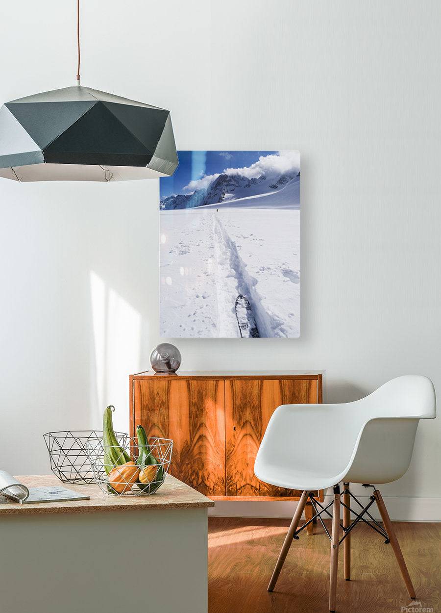 Two distant skiers ski touring across the Ottemma glacier, with skinning tracks - Powderaddicts