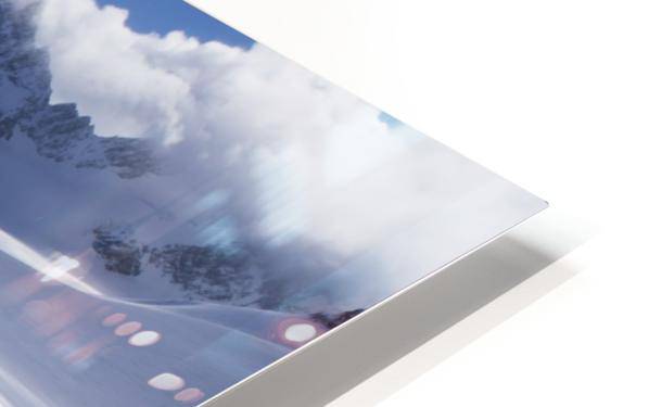 Two distant skiers ski touring across the Ottemma glacier, with skinning tracks - Powderaddicts