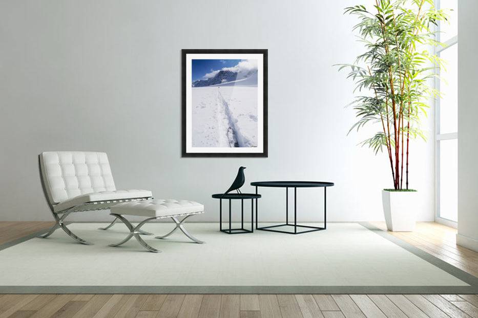 Two distant skiers ski touring across the Ottemma glacier, with skinning tracks - Powderaddicts