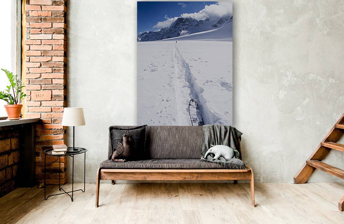 Two distant skiers ski touring across the Ottemma glacier, with skinning tracks - Powderaddicts