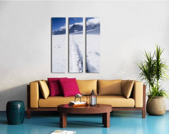 Two distant skiers ski touring across the Ottemma glacier, with skinning tracks - Powderaddicts