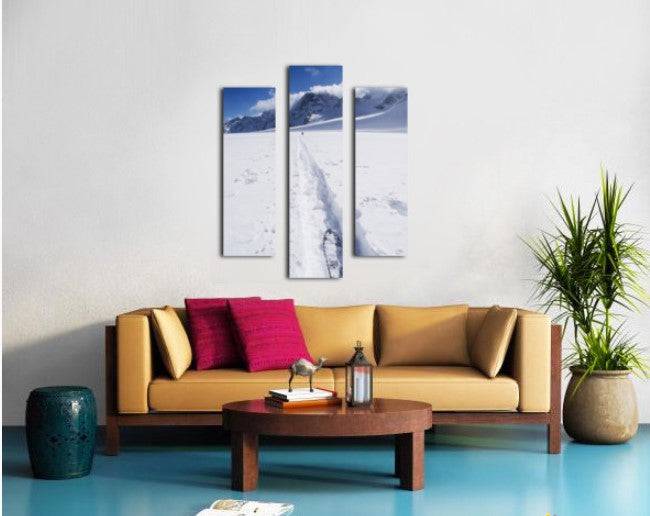 Two distant skiers ski touring across the Ottemma glacier, with skinning tracks - Powderaddicts