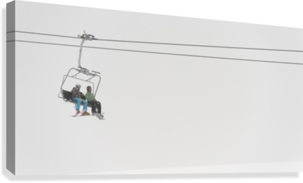Two People Riding A Chairlift At A Ski Resort - Powderaddicts