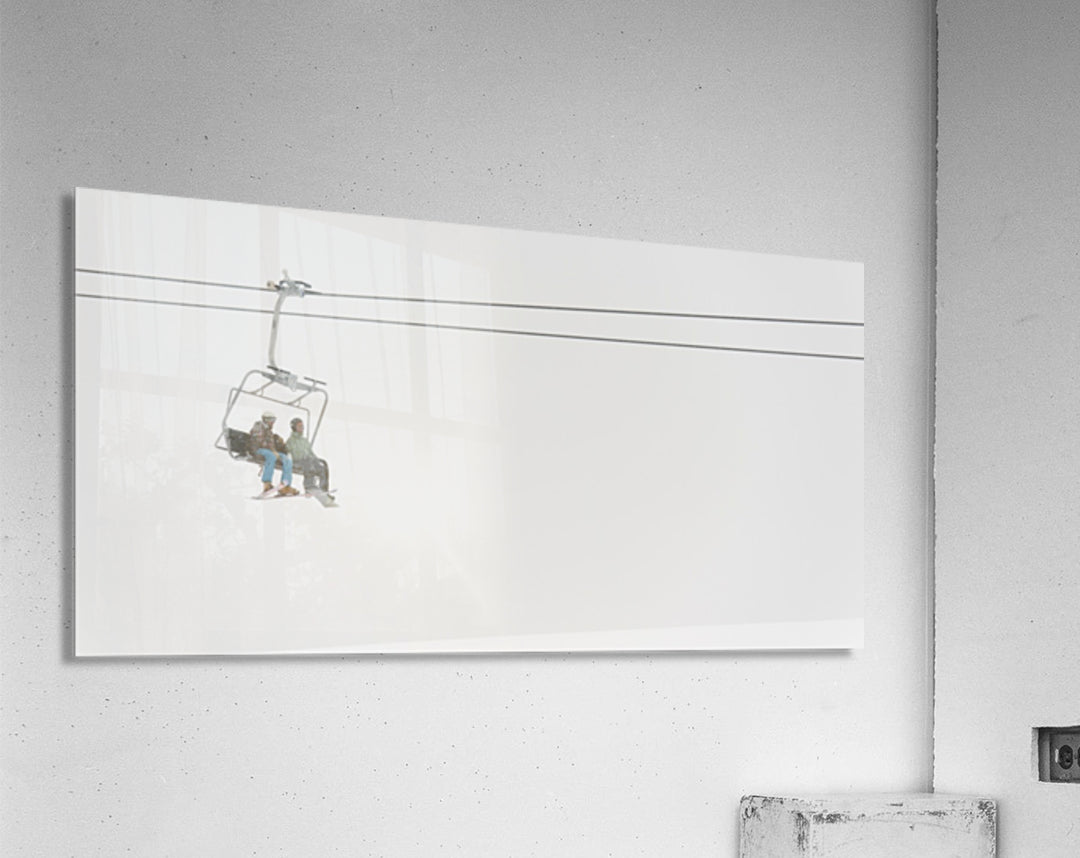 Two People Riding A Chairlift At A Ski Resort - Powderaddicts