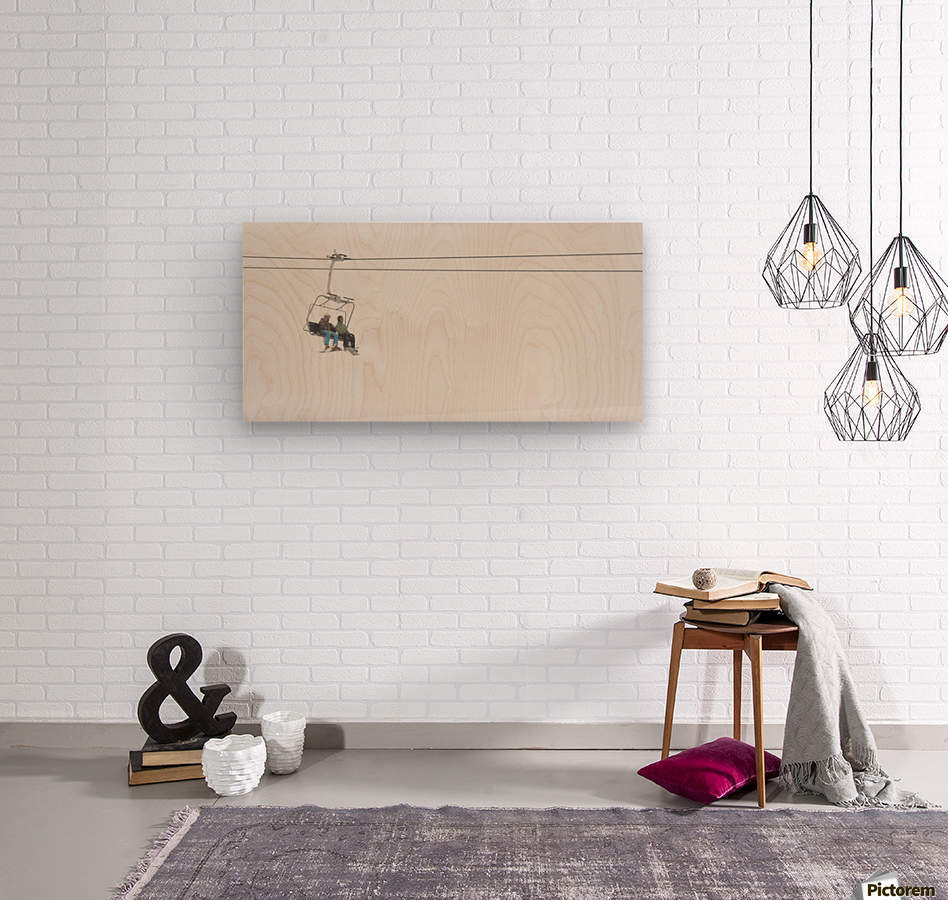 Two People Riding A Chairlift At A Ski Resort - Powderaddicts