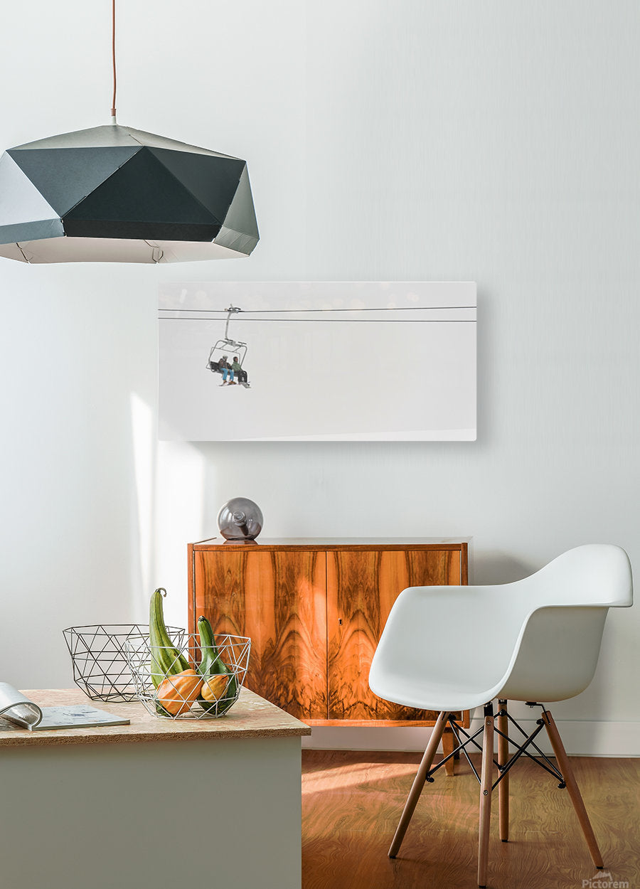 Two People Riding A Chairlift At A Ski Resort - Powderaddicts