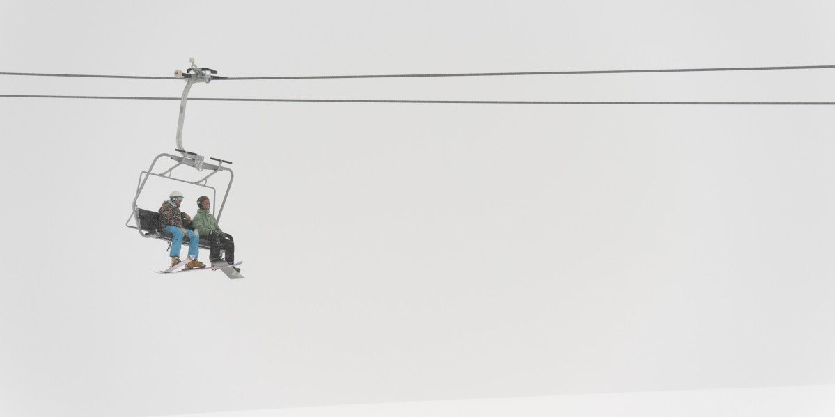 Two People Riding A Chairlift At A Ski Resort - Powderaddicts