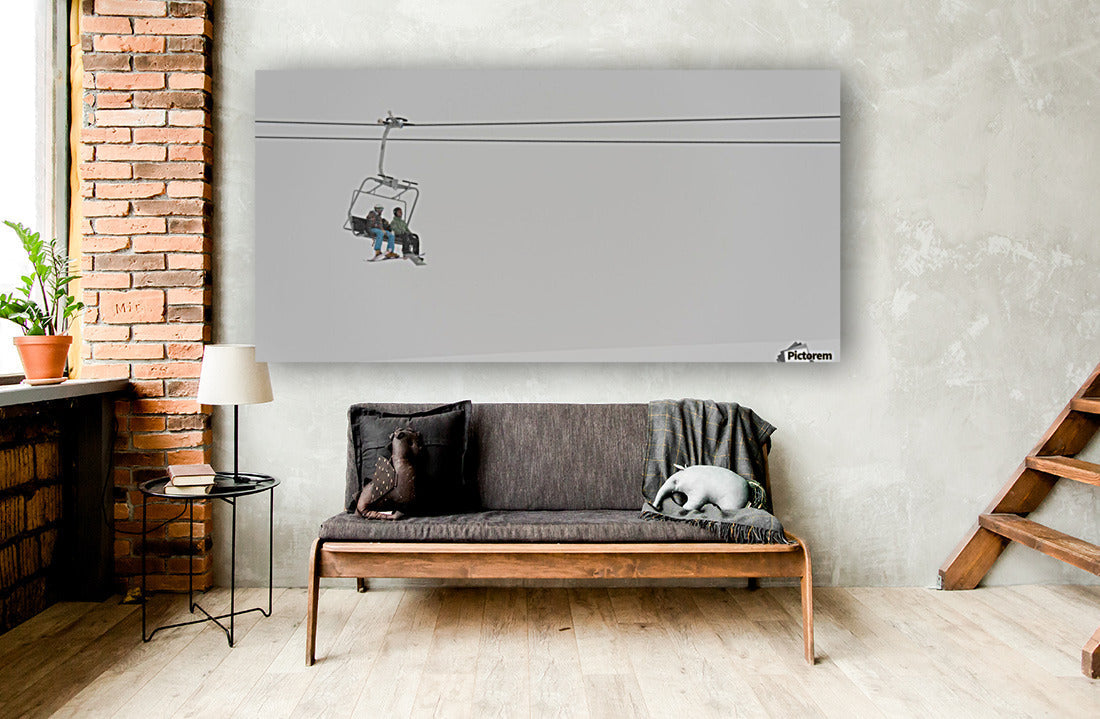 Two People Riding A Chairlift At A Ski Resort - Powderaddicts