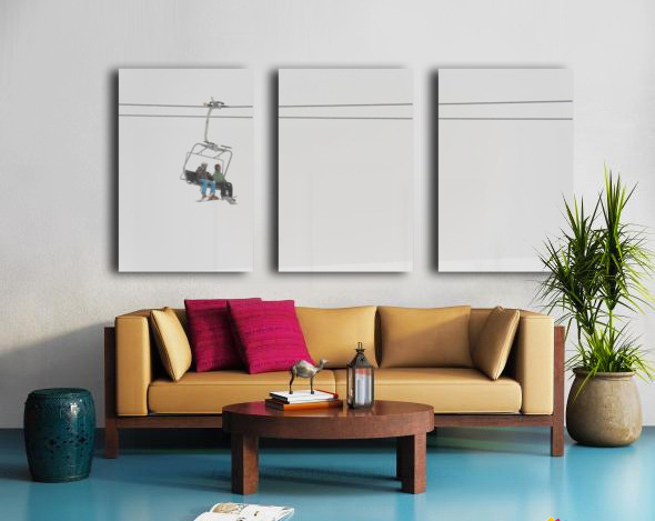 Two People Riding A Chairlift At A Ski Resort - Powderaddicts