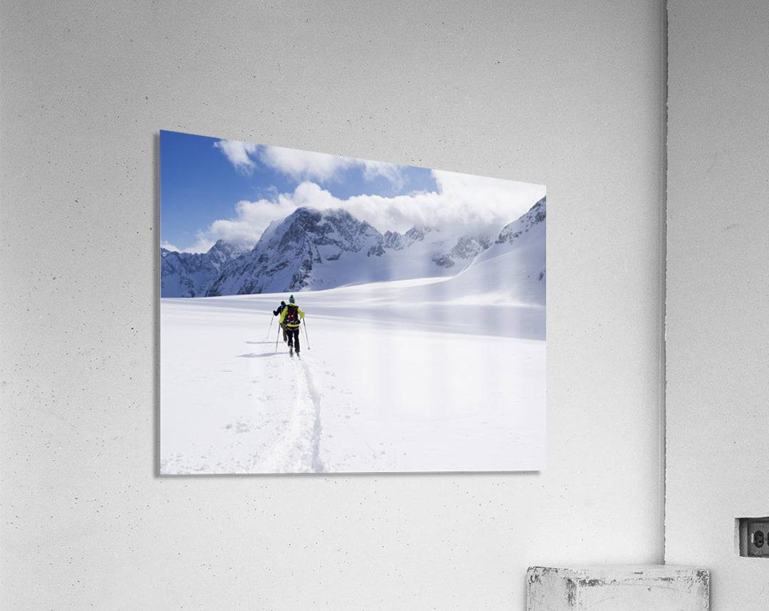 Two skiers ski touring across the Ottemma glacier - Powderaddicts