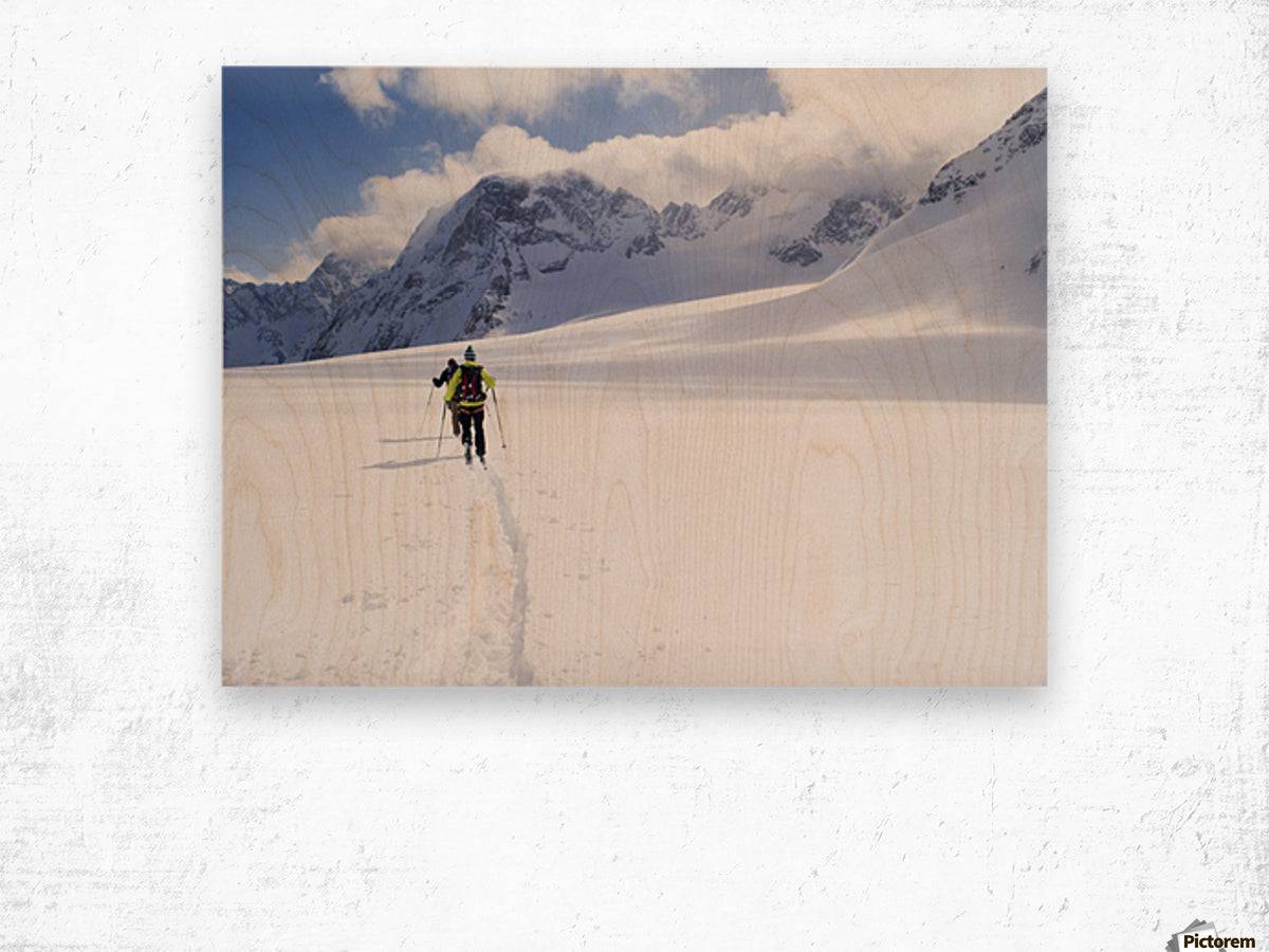 Two skiers ski touring across the Ottemma glacier - Powderaddicts