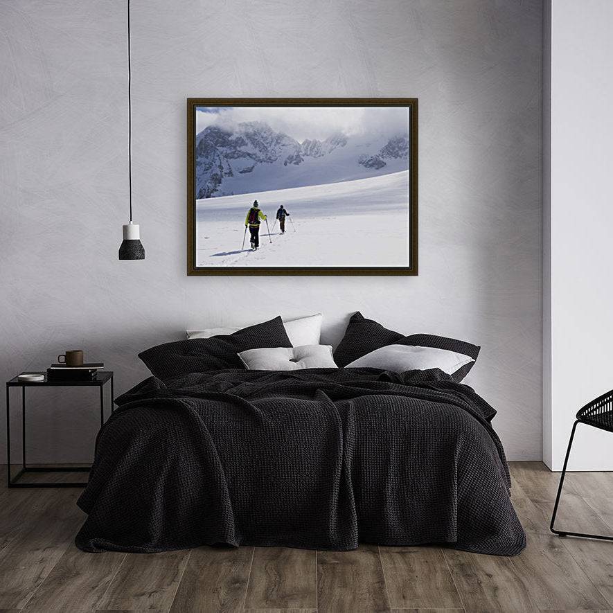 Two skiers ski touring across the Ottemma glacier - Powderaddicts