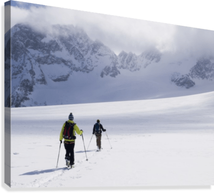 Two skiers ski touring across the Ottemma glacier - Powderaddicts